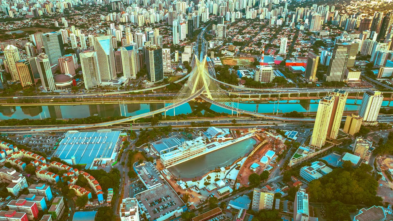 Aerial cityscape of São Paulo showcasing the iconic Ponte Estaiada and vibrant urban environment.